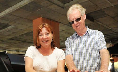 Louise and John Barselaar contemplate an early winter purchase, a gas fire from Edwards Hot Water, at the Coffs Coast Home Show. Louise and John Barselaar contemplate an early winter purchase, a gas fire from Edwards Hot Water, at the Coffs Coast Home Show.